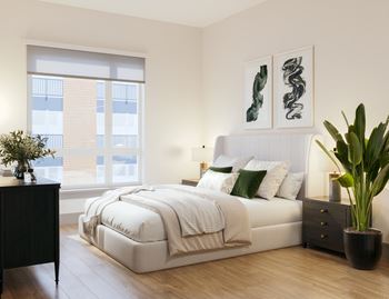 Serene bedroom with upholstered bed and green accents